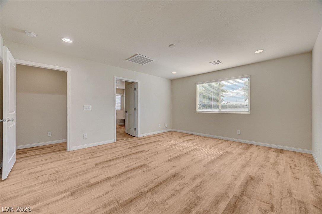 113 Elm Reed Avenue Las Vegas, NV 89113 - Photo 31 of 62 Unfurnished bedroom featuring light wood-style floors and recessed lighting