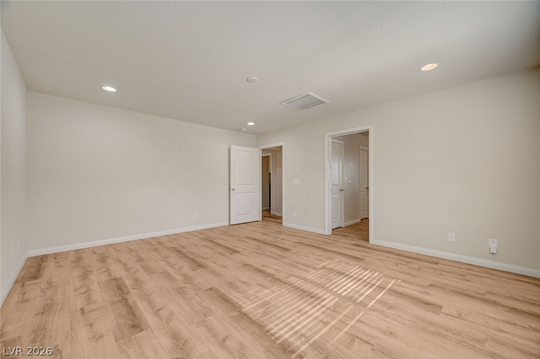 113 Elm Reed Avenue Las Vegas, NV 89113 - Photo 32 of 62 Unfurnished bedroom featuring light wood-type flooring and recessed lighting