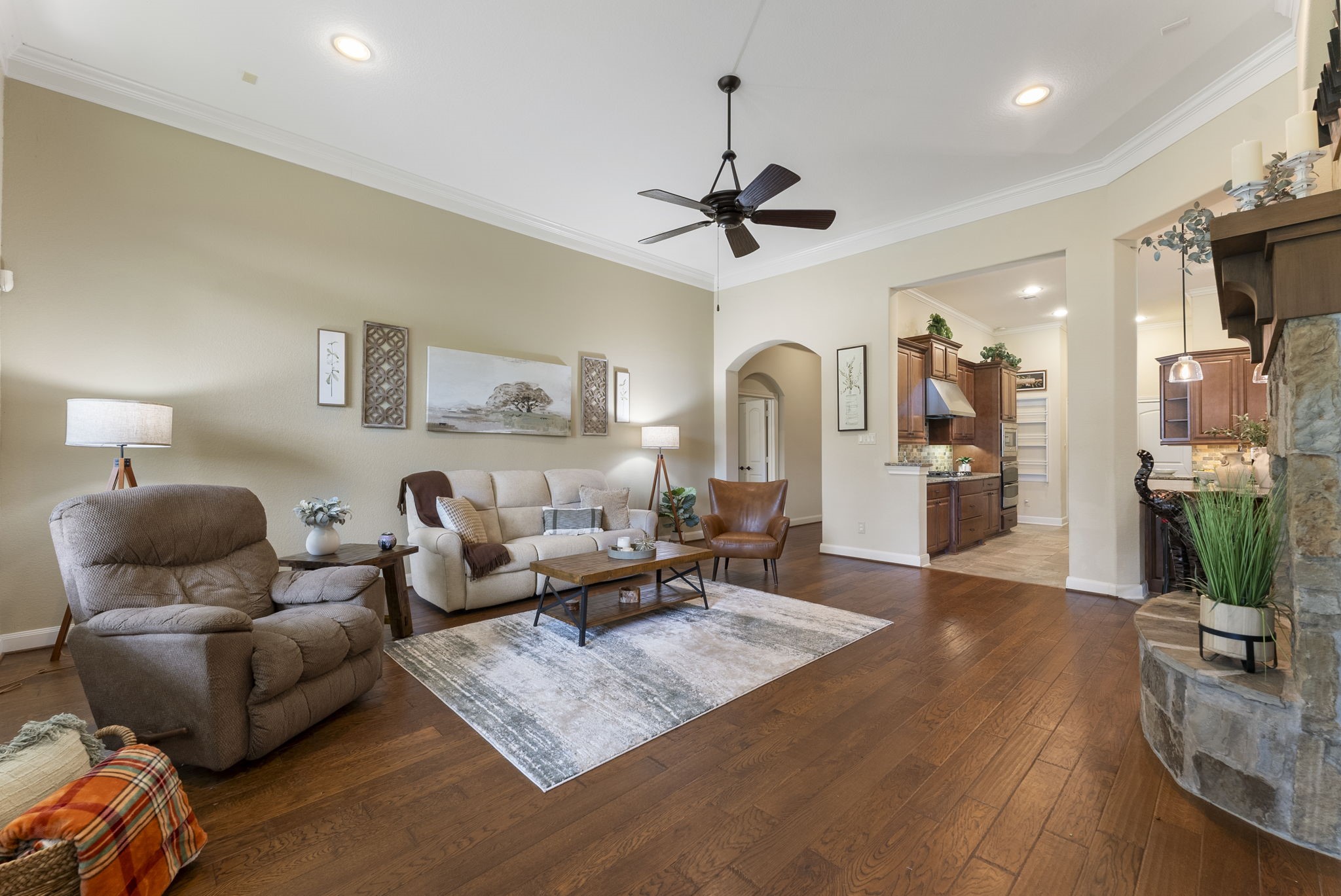 4787 Jackson Square Drive Conroe, TX 77304 - Photo 7 of 35 At the heart of the room, a gas log fireplace beckons you to gather 'round, offering both cozy warmth and a sophisticated focal point. Whether it’s movie nights, quiet mornings with coffee, or hosting loved ones, this space is designed to make every moment unforgettable.