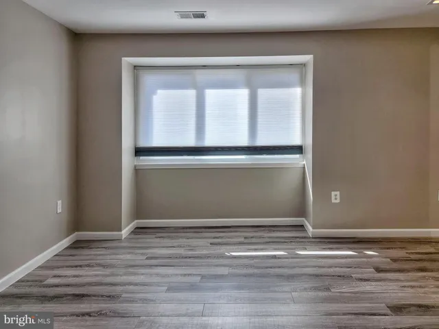 a bathroom with a toilet and shower