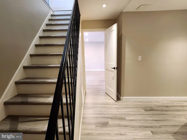 a kitchen with granite countertop wooden cabinets a sink and dishwasher