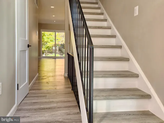 a view of a hallway with entryway door