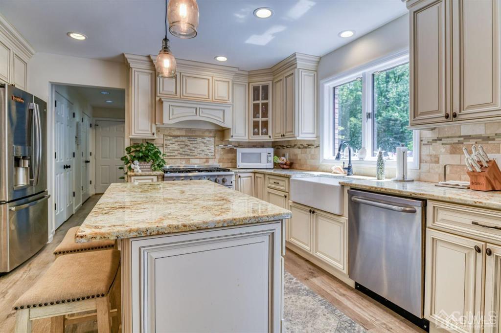 59 Friendship Road Cranbury, NJ 08512 - Photo 11 of 31 a kitchen with a sink stove and refrigerator
