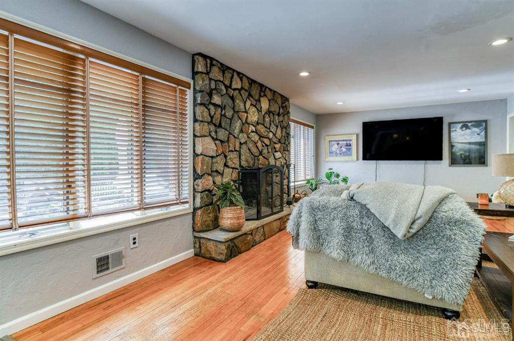59 Friendship Road Cranbury, NJ 08512 - Photo 15 of 31 a living room with furniture and a flat screen tv