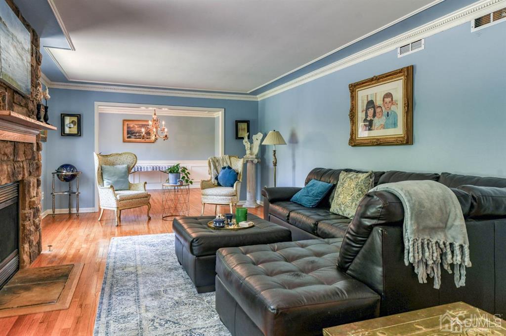 59 Friendship Road Cranbury, NJ 08512 - Photo 16 of 31 a living room with furniture and painting on the wall