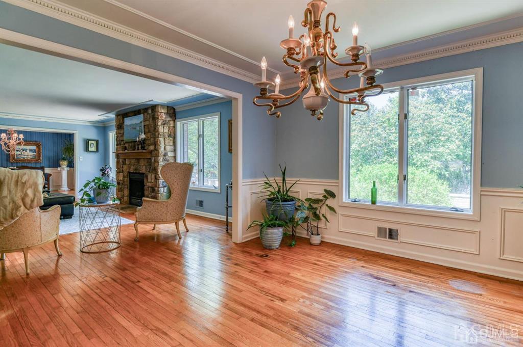 59 Friendship Road Cranbury, NJ 08512 - Photo 18 of 31 a living room filled with furniture and a chandelier
