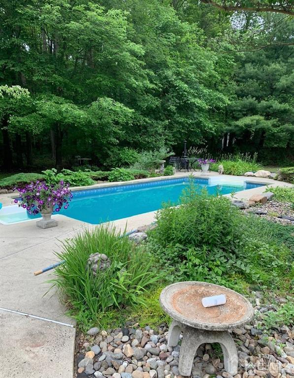 59 Friendship Road Cranbury, NJ 08512 - Photo 31 of 31 a view of a backyard with a garden and plants