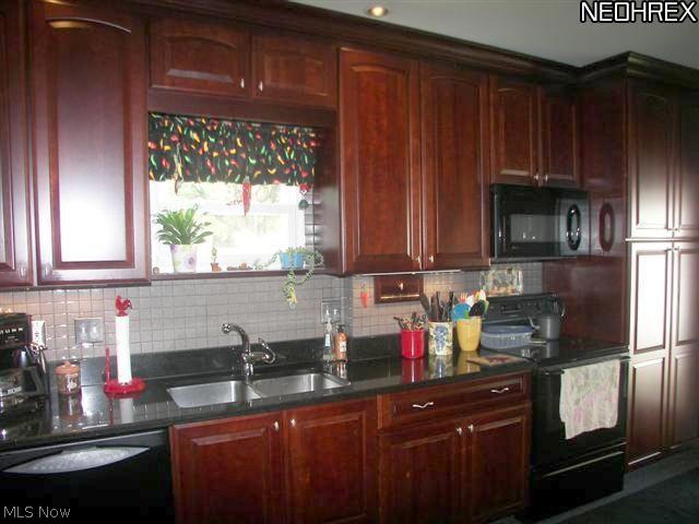 118 Canton Road Akron, OH 44312 - Photo 6 of 24 Another view of fully applianced kitchen