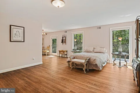 a bedroom with a bed and a television