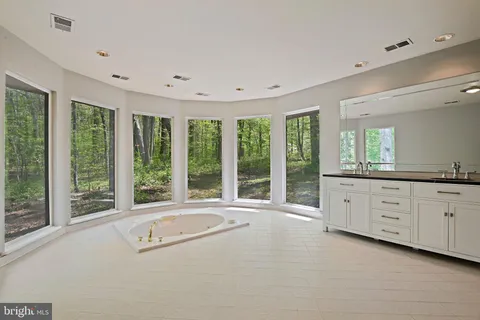 a room with a dresser and a window