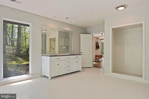 a view of an empty room with glass door