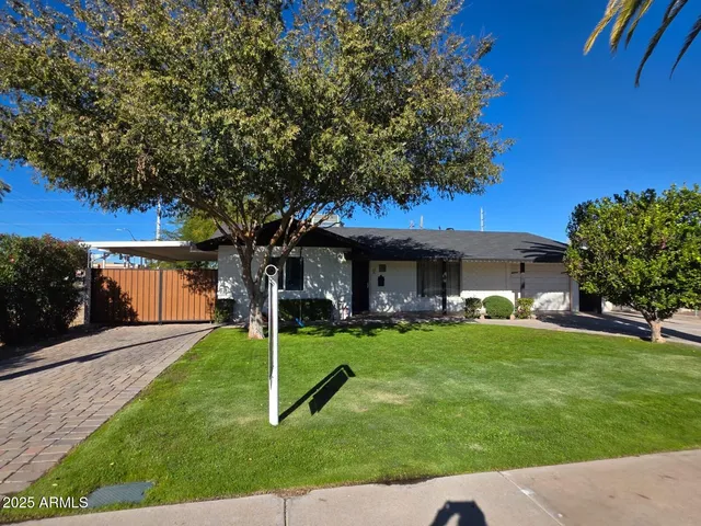 a view of a house with a yard porch and sitting area