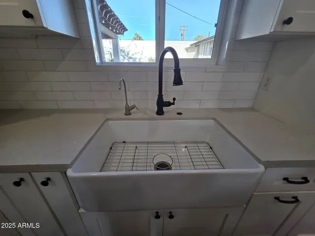 a stove top oven sitting inside of a kitchen