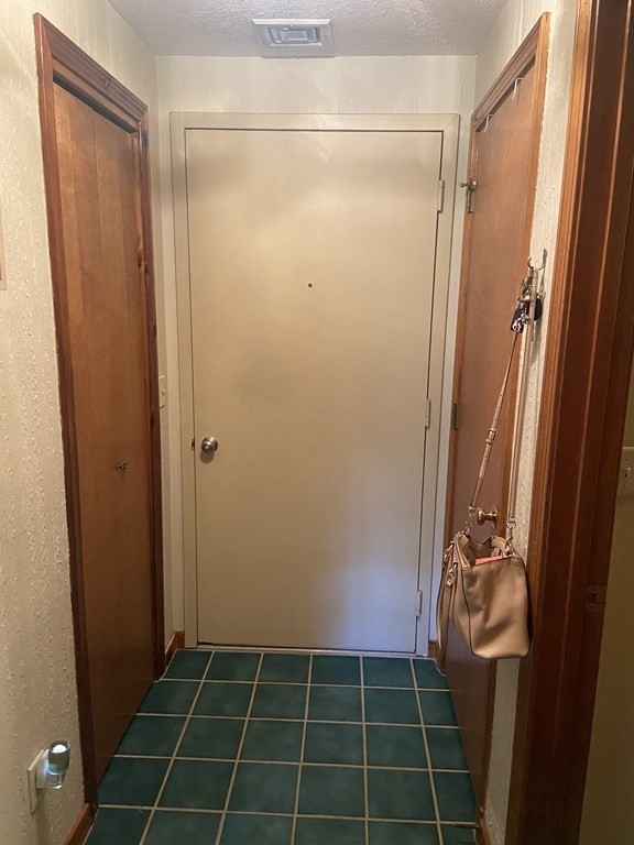 132 West Meadow Road, Unit 7 Haverhill, MA 01832 - Photo 2 of 12 a bathroom with a glass shower door