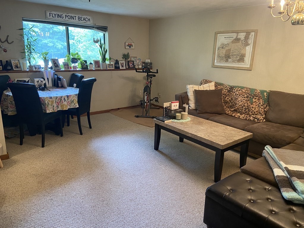 132 West Meadow Road, Unit 7 Haverhill, MA 01832 - Photo 3 of 12 a living room with furniture and a large window