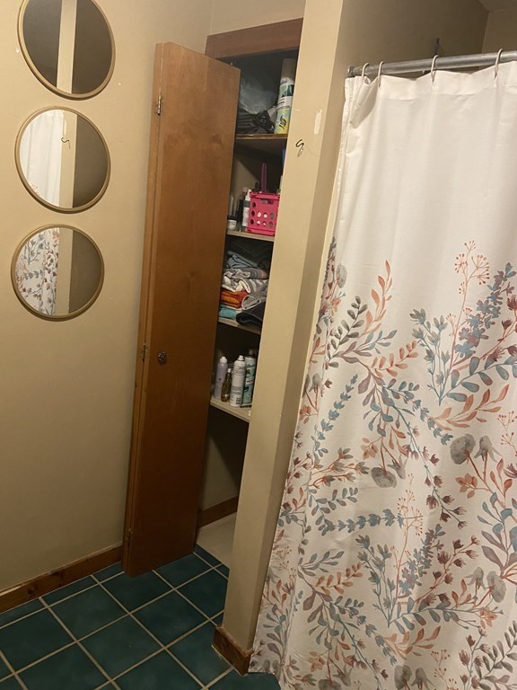 132 West Meadow Road, Unit 7 Haverhill, MA 01832 - Photo 9 of 12 a bathroom with a toilet and a shower