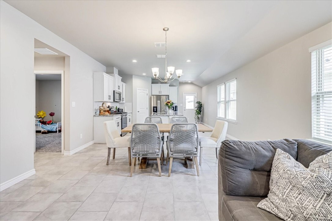 7630 Shadow Rider Lane Corpus Christi, TX 78414 - Photo 12 of 39 a living room with furniture and a chandelier