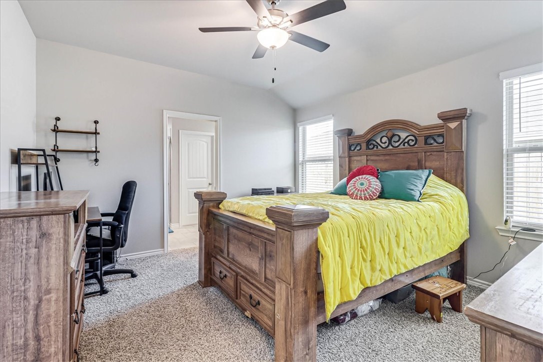 7630 Shadow Rider Lane Corpus Christi, TX 78414 - Photo 21 of 39 a bedroom with a bed and a chandelier