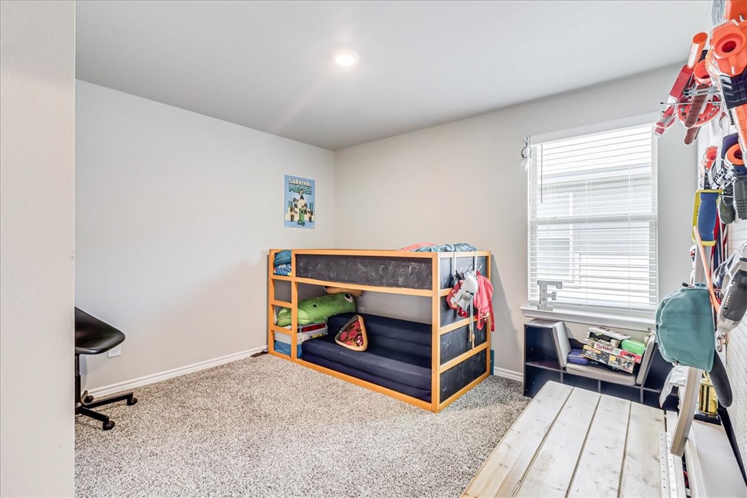 7630 Shadow Rider Lane Corpus Christi, TX 78414 - Photo 27 of 39 a bedroom with a bed and a window