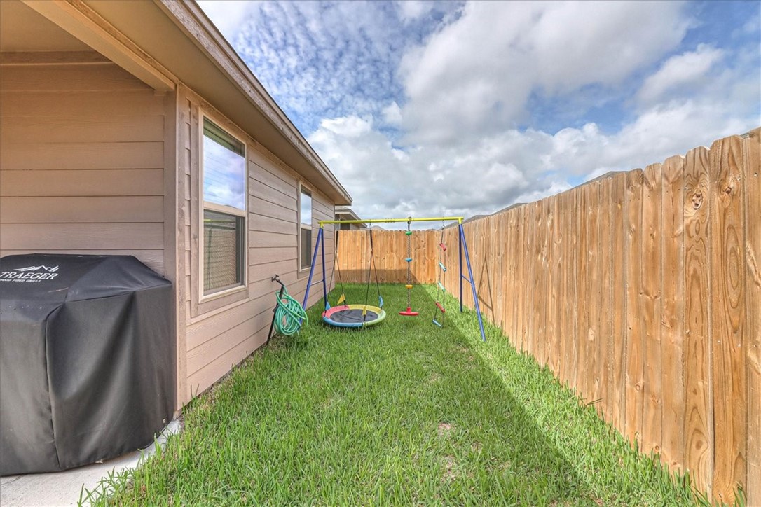 7630 Shadow Rider Lane Corpus Christi, TX 78414 - Photo 36 of 39 a view of a backyard with pathway