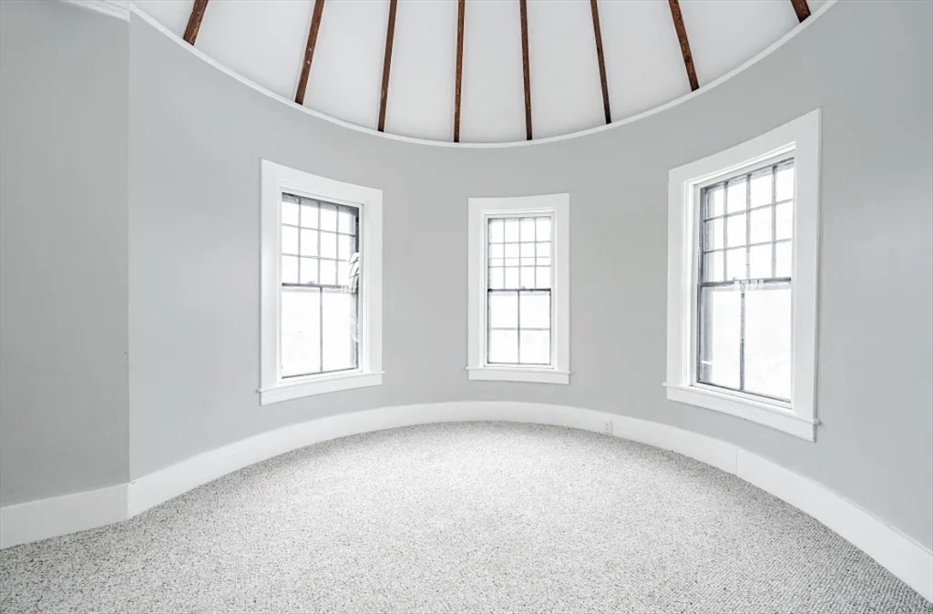 1137 Dwight Street, Unit C Holyoke, MA 01040 - Photo 7 of 9 an empty room with a window