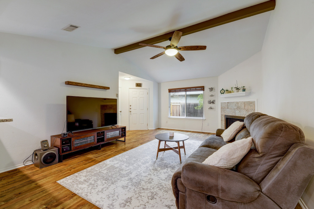 6002 Baton Rouge Drive Austin, TX 78727 - Photo 6 of 20 Vaulted ceiling with exposed wood beams and a ceiling fan