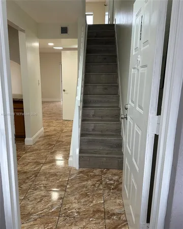 a view of entryway with wooden floor