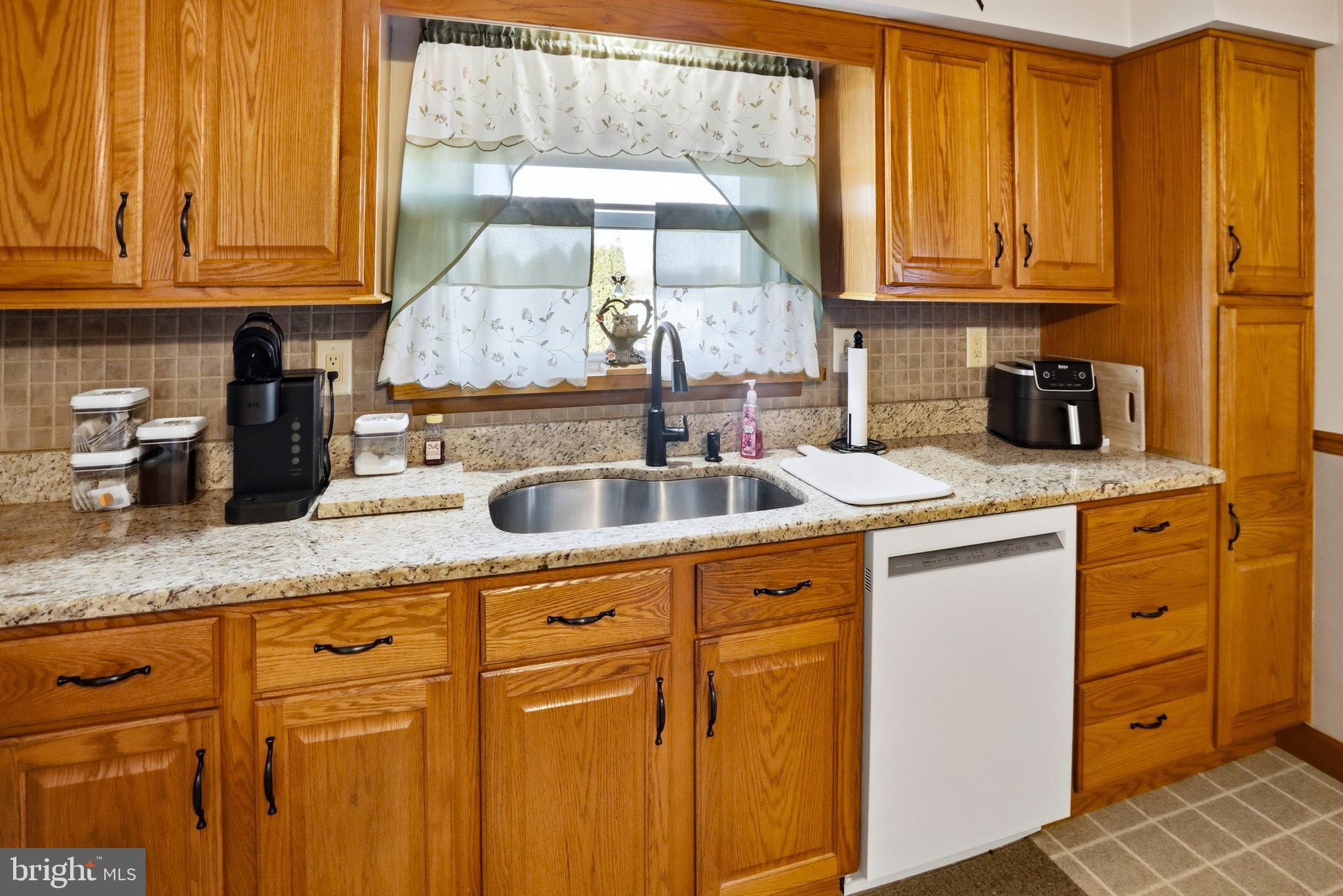643 West 3rd Street Birdsboro, PA 19508 - Photo 10 of 28 a kitchen with sink cabinets and window