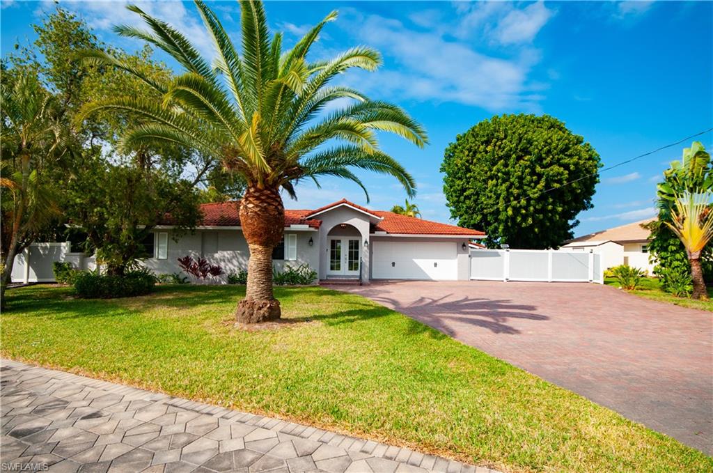 13308 Island Road Fort Myers, FL 33905 - Photo 39 of 39 a front view of a house with garden