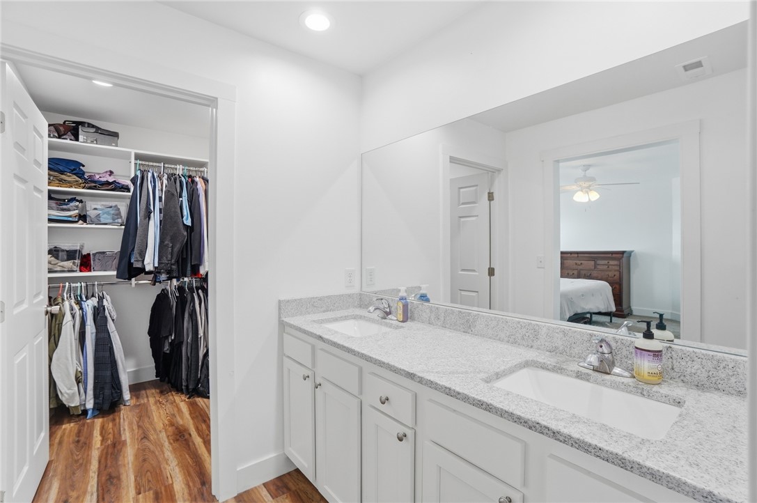 728 East Northern Avenue Springfield, OH 45503 - Photo 19 of 35 This bathroom features a double vanity and an adjacent walk-in closet, perfect for daily routines.
