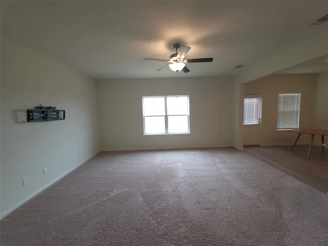 a view of empty room with windows