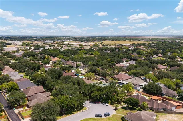 an aerial view of a houses with yard