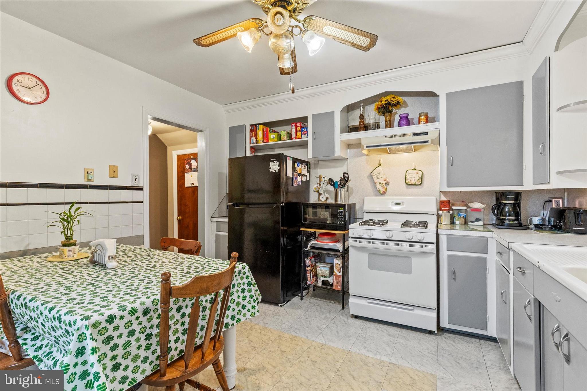 33 North Adams Street York, PA 17404 - Photo 11 of 42 a kitchen with a refrigerator and a stove top oven