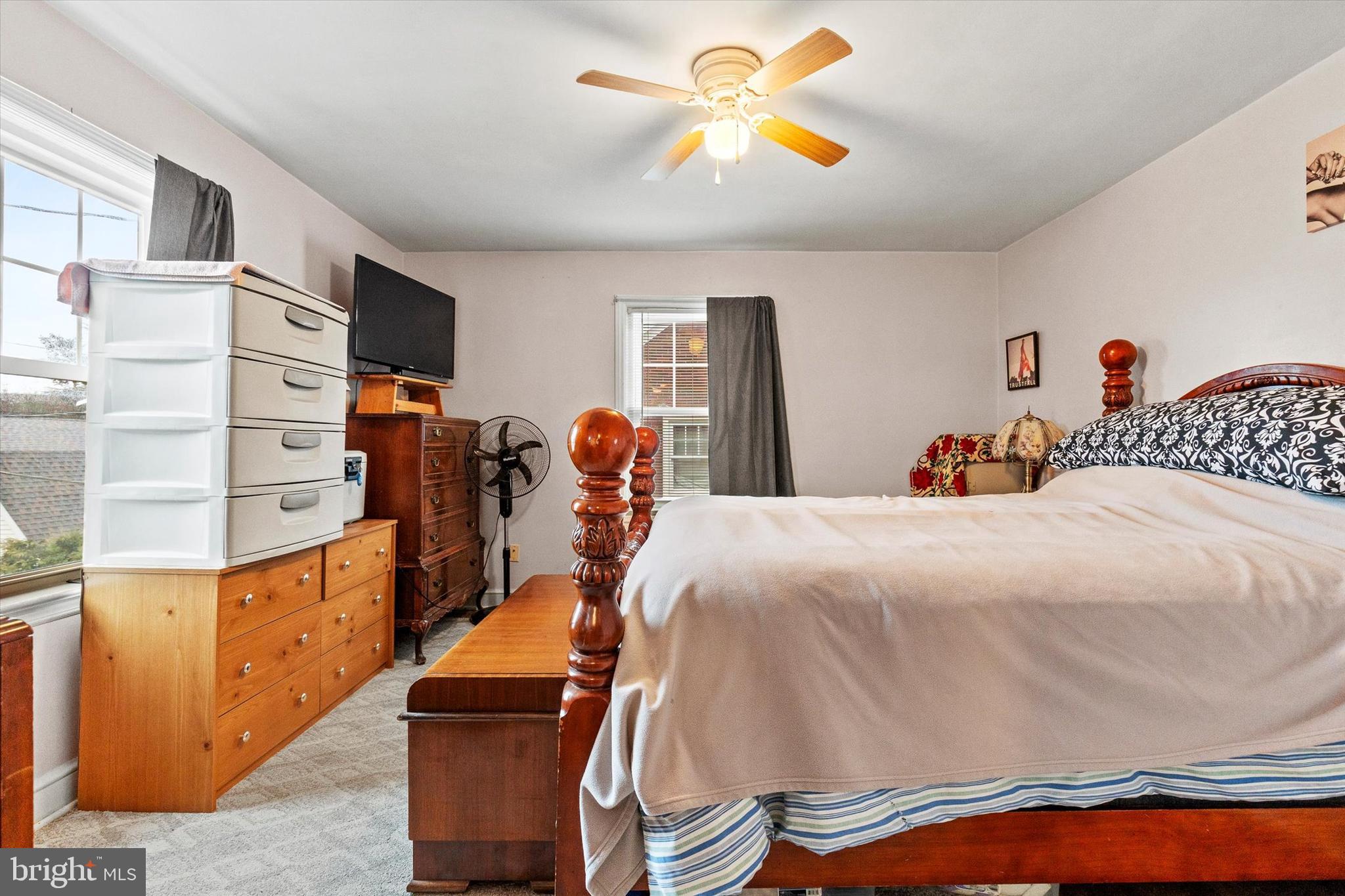 33 North Adams Street York, PA 17404 - Photo 16 of 42 a bed room with a bed and a chandelier