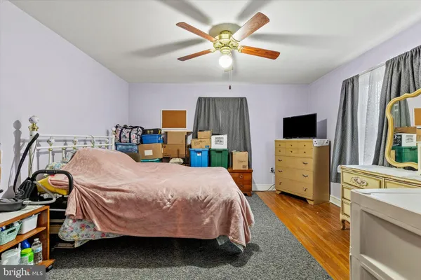 a bedroom with a bed and a tv