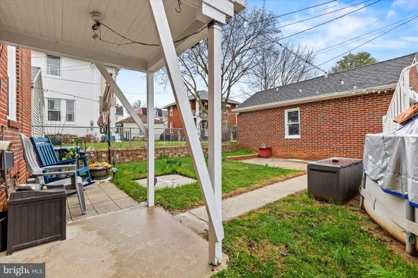 a front view of a house with patio and garden