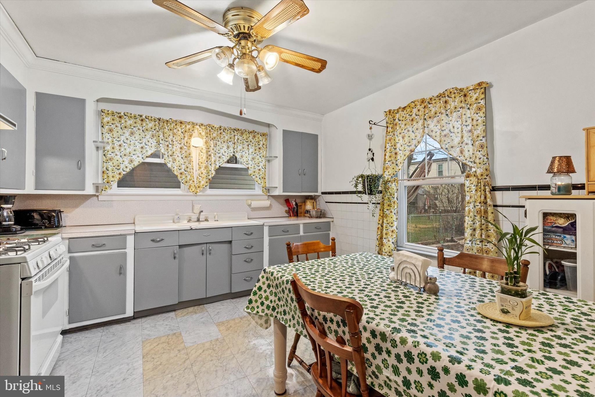 33 North Adams Street York, PA 17404 - Photo 9 of 42 a kitchen with a table chairs stove and cabinets