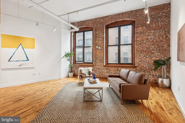 a living room with furniture and a rug