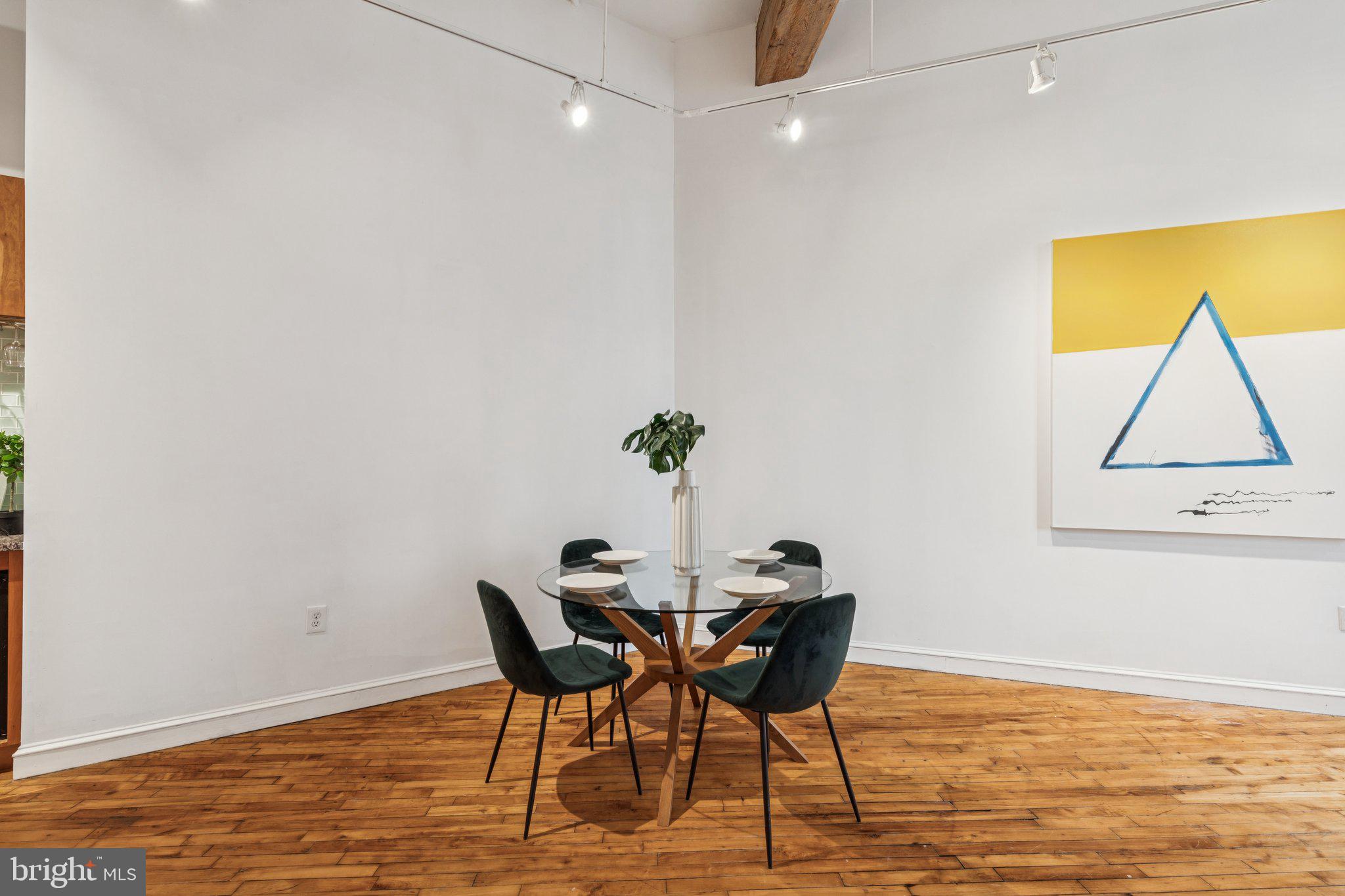 428 North 13th Street, Unit 3F Philadelphia, PA 19123 - Photo 11 of 48 a view of a dining room with furniture and wooden floor