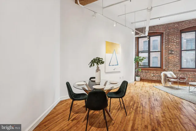 a view of a dining room with furniture and window