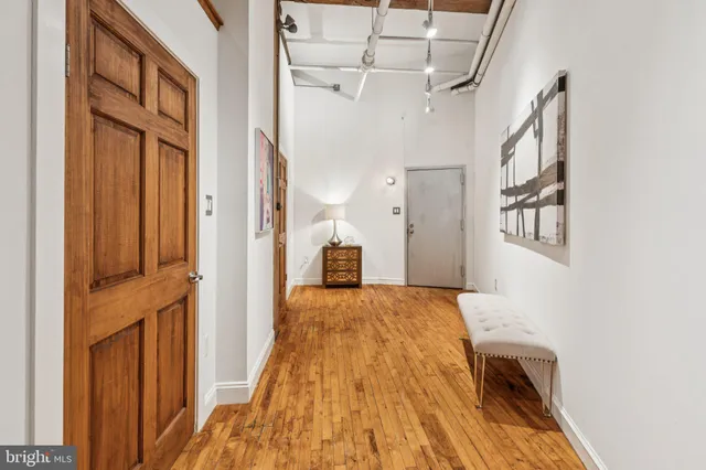 a bedroom with double bed and a large window