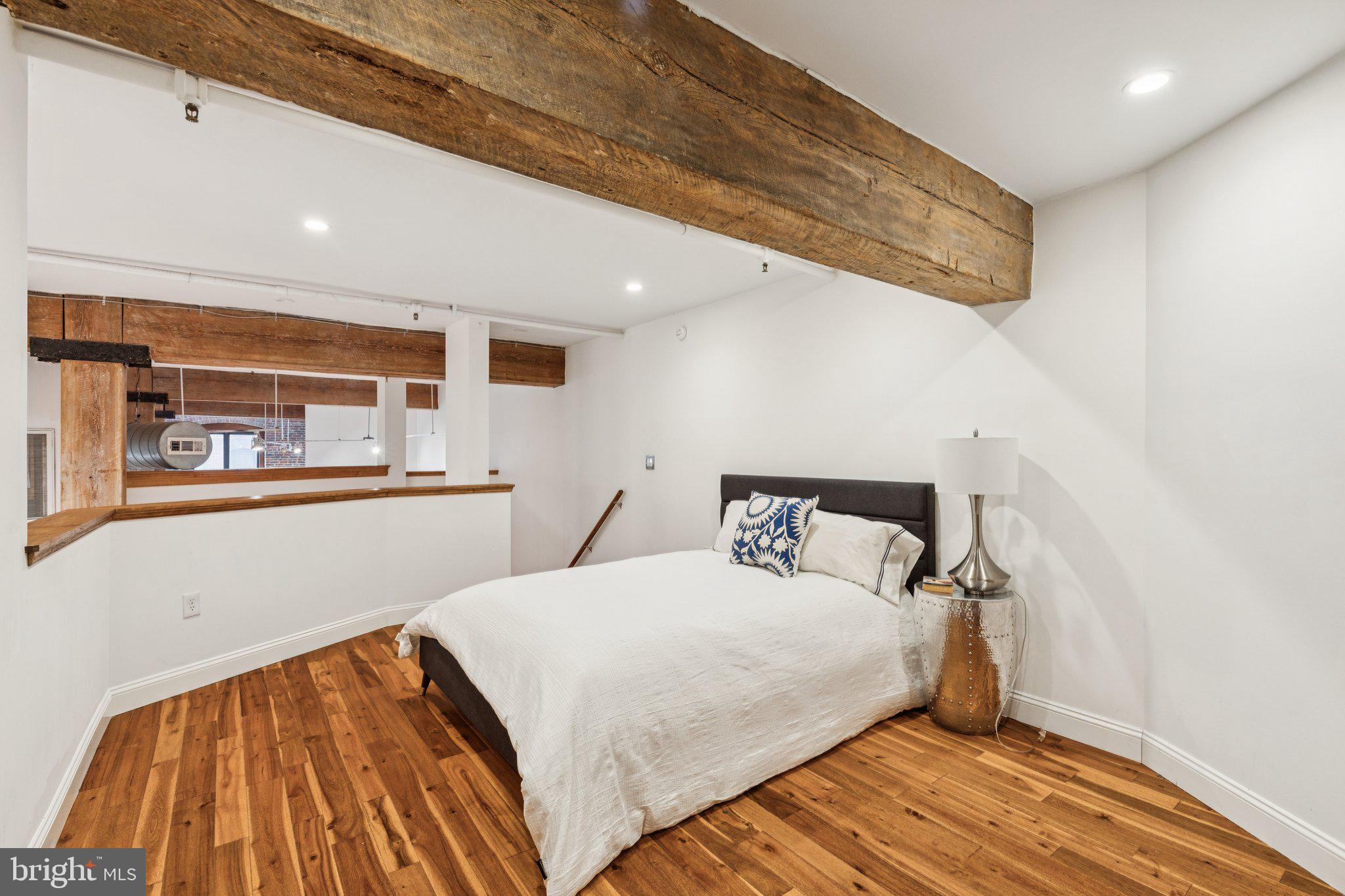 428 North 13th Street, Unit 3F Philadelphia, PA 19123 - Photo 18 of 48 a bedroom with double bed and a large window