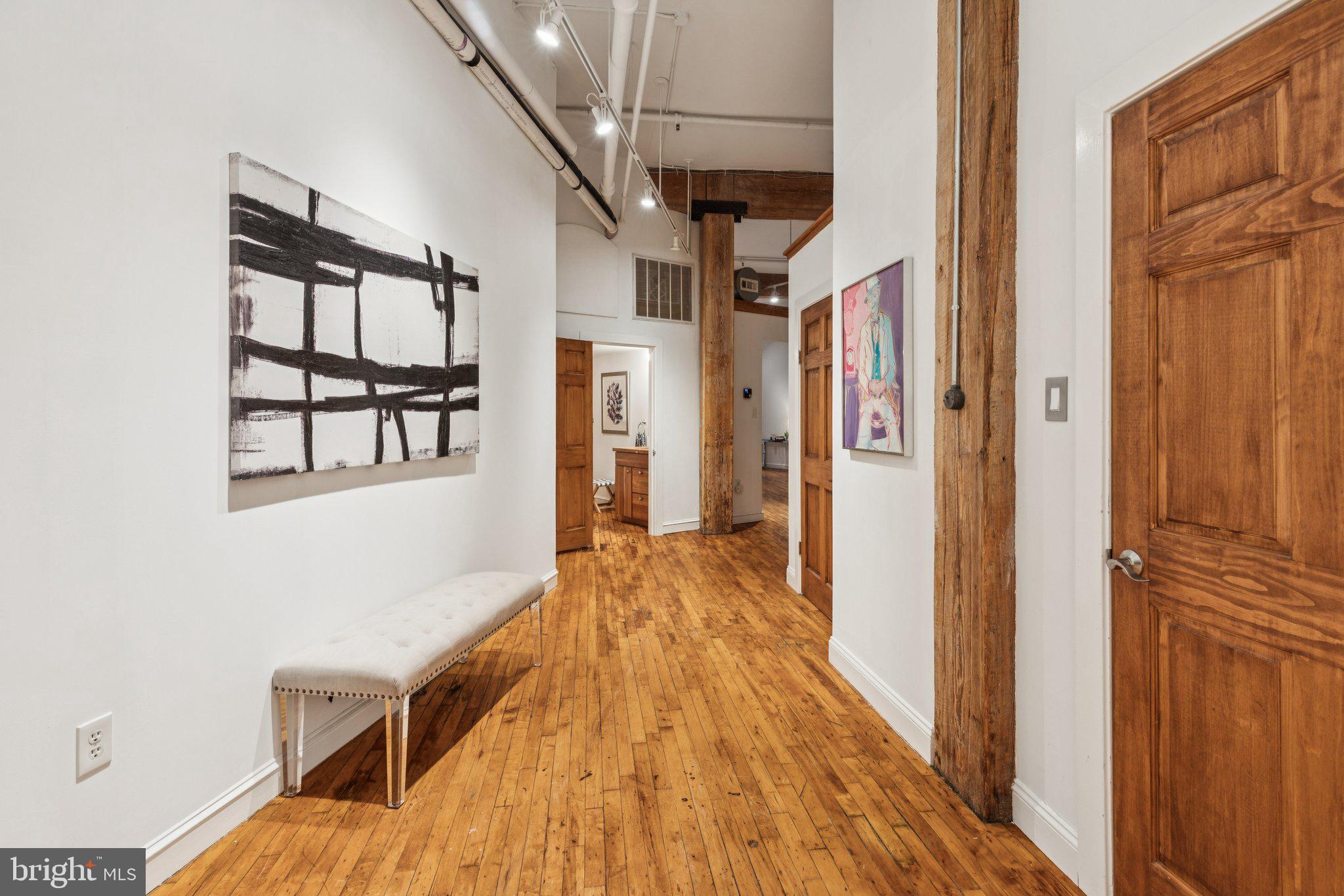 428 North 13th Street, Unit 3F Philadelphia, PA 19123 - Photo 2 of 48 a view of hallway with wooden floor and staircase