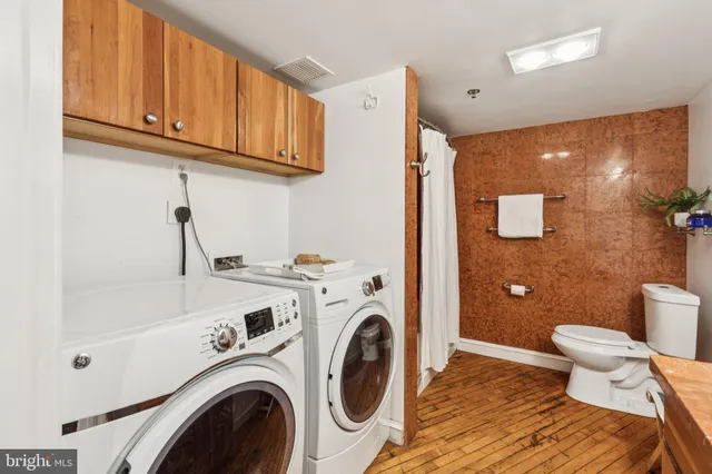a view of a living room and kitchen with a large window