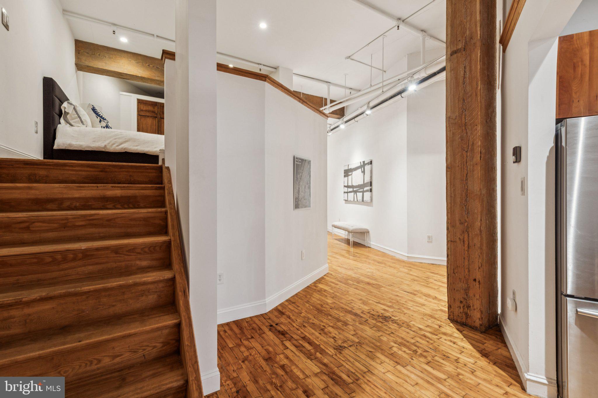 428 North 13th Street, Unit 3F Philadelphia, PA 19123 - Photo 27 of 48 a view of a hallway with wooden floor and entryway