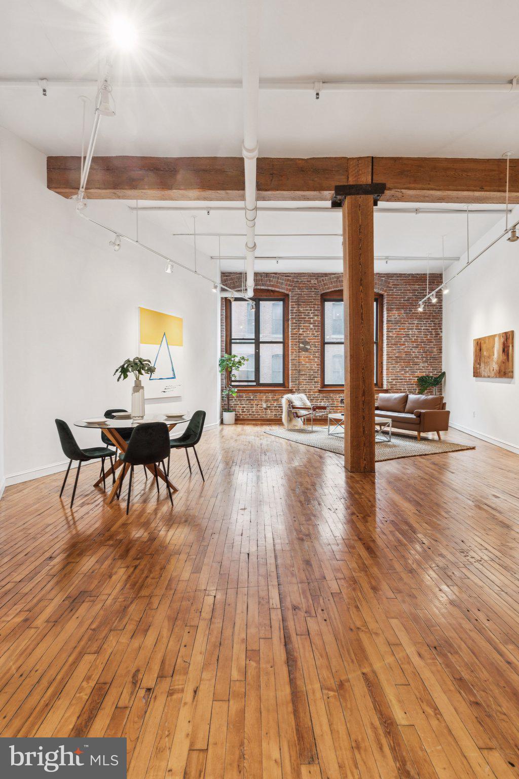 428 North 13th Street, Unit 3F Philadelphia, PA 19123 - Photo 28 of 48 a view of a living room and kitchen with a large window
