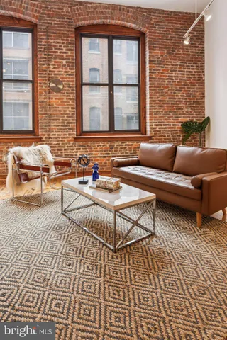 a living room with a couch and a window