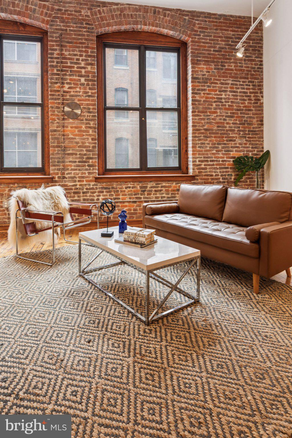 428 North 13th Street, Unit 3F Philadelphia, PA 19123 - Photo 3 of 48 a living room with a couch and a window