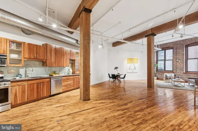 a view of kitchen with furniture and wooden floor