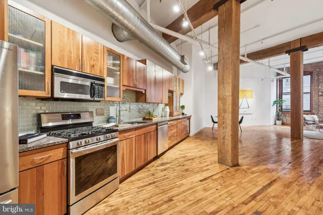 a view of living room with furniture and floor to ceiling window